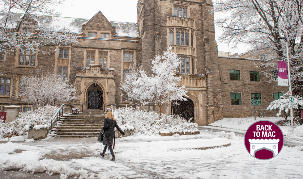 winter scene with snow on university campus. A person walks into a building